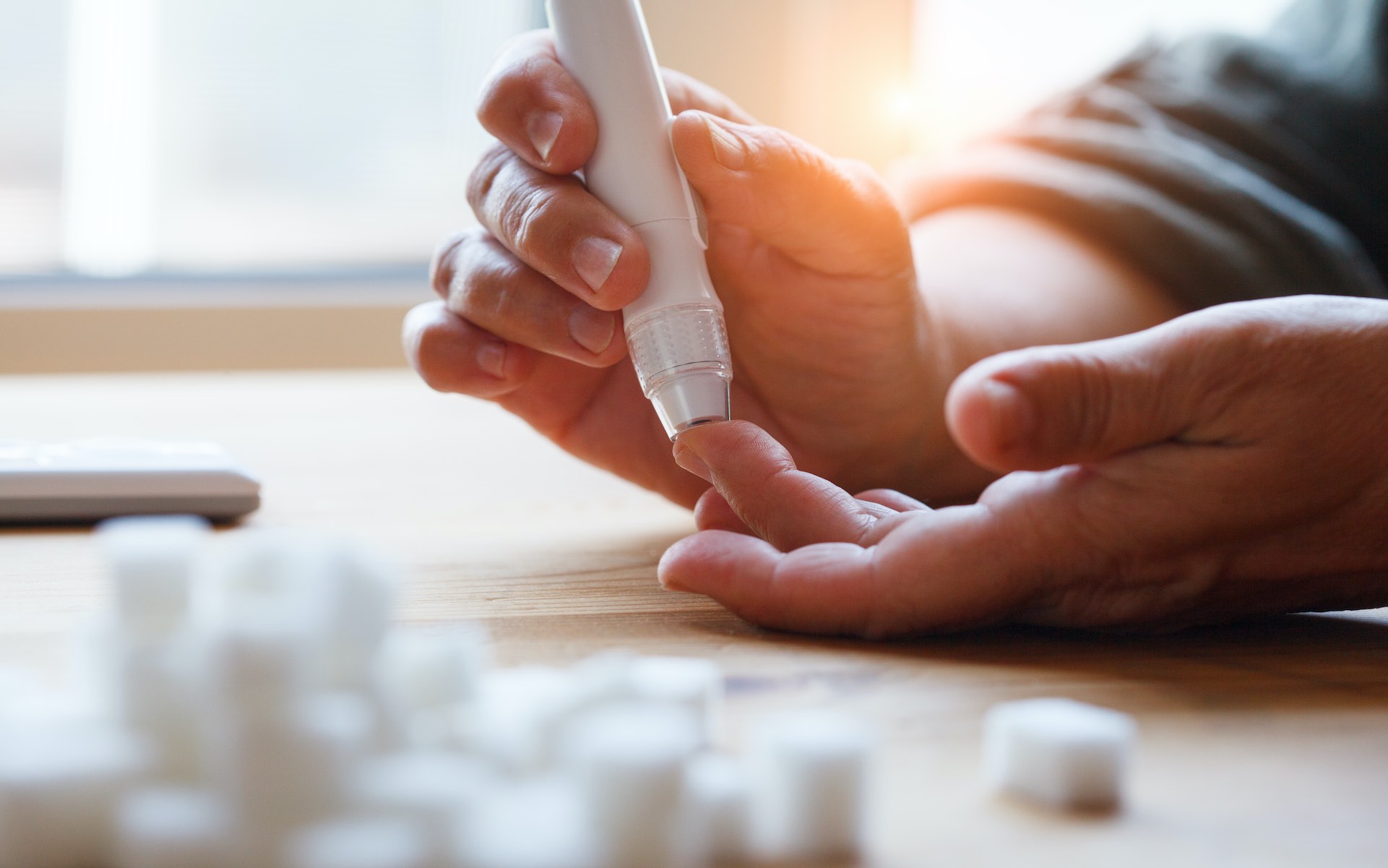 Diabetes patient doing a finger prick test