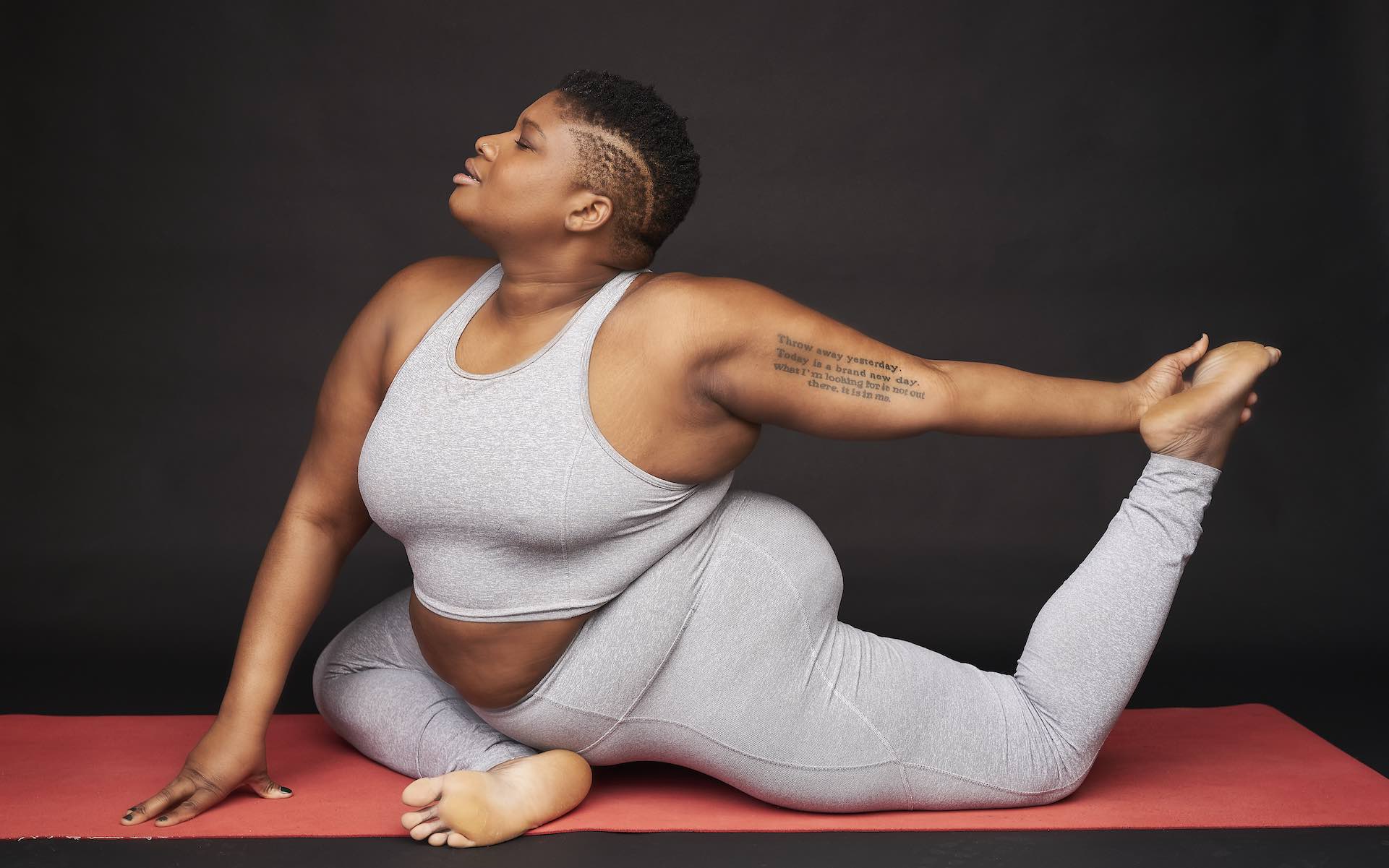 A woman performs a yoga move