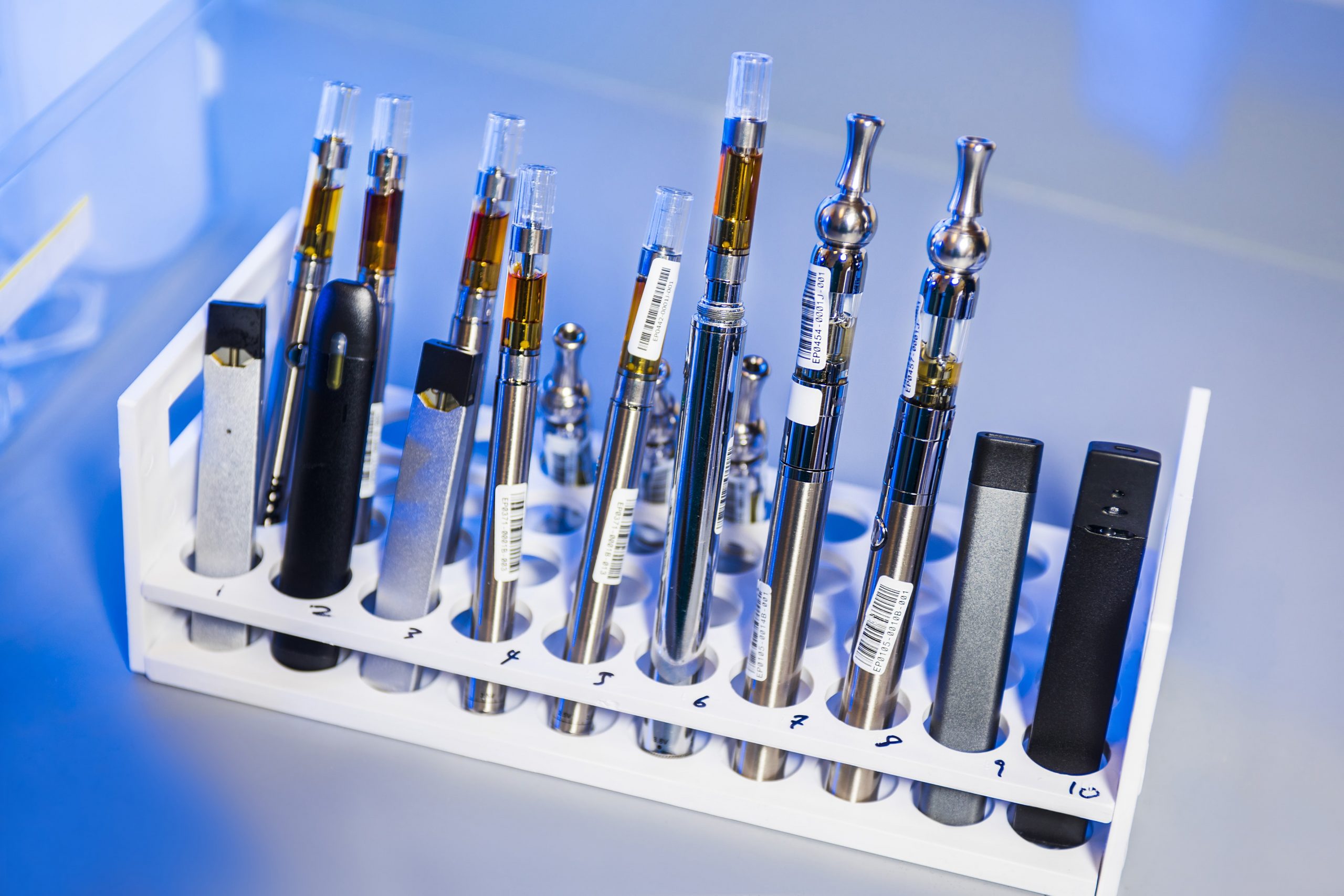 An assortment of vape devices and oils