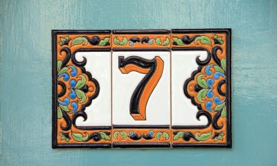 The number 7 on a tile on a door