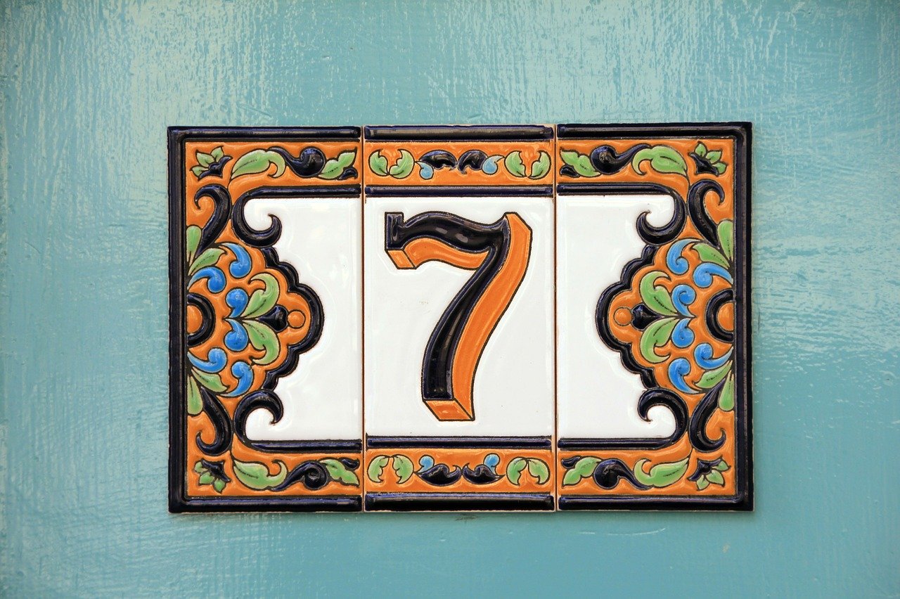 The number 7 on a tile on a door