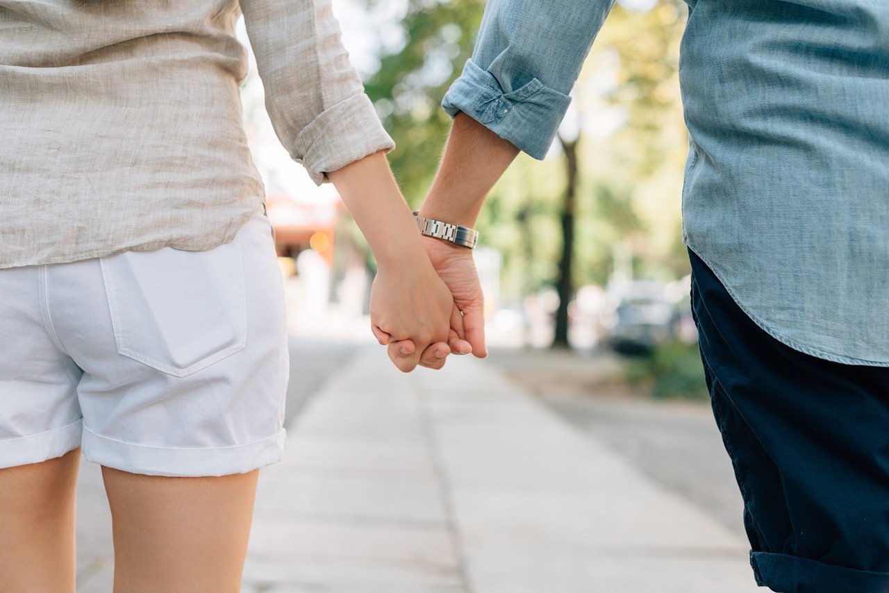 a couple holding hands