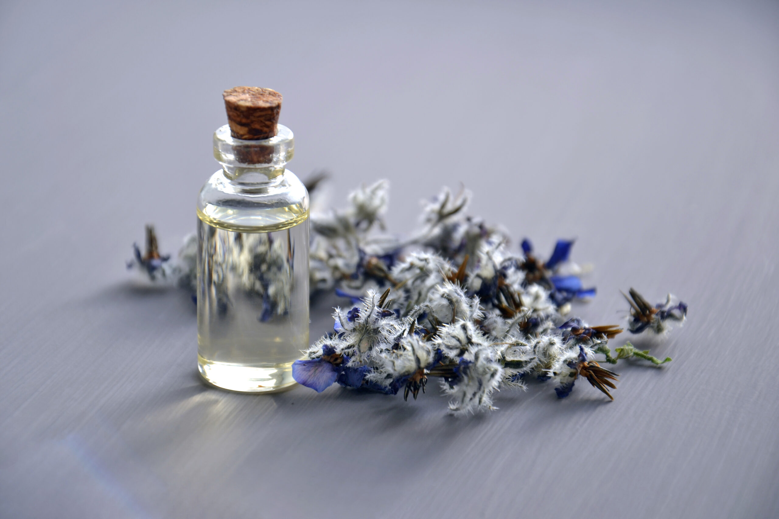 A bottle of tincture near some lavender flowers