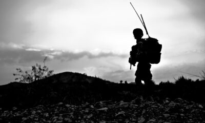 A soldier on a black and white background