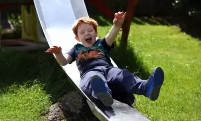 Little boy called Murray enjoyed a slide
