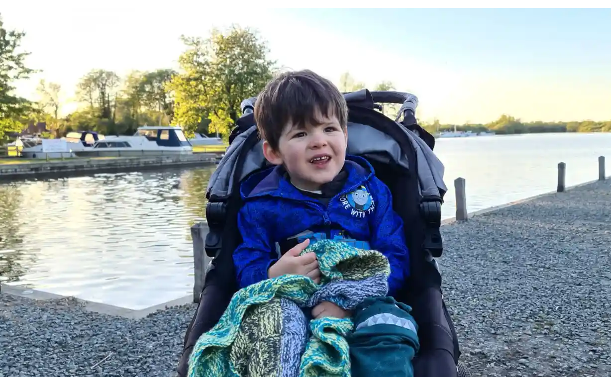 A little boy in a pushchair