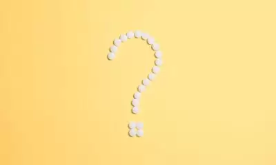 A white question mark ? symbol on a yellow background