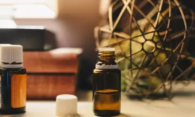 A brown bottle of oil on a wooden table