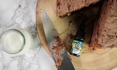 Chocolate cake with a glass of CBD and Hippie Turtle Herbal Co CBD oil.
