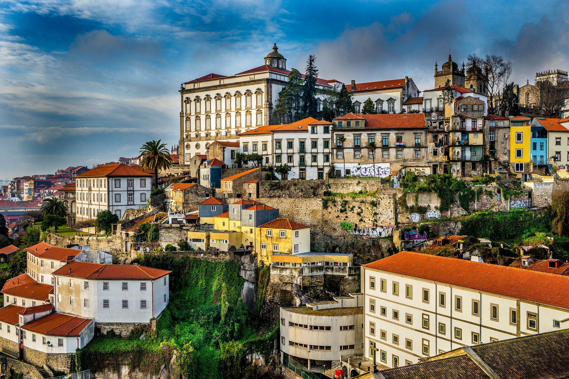 A colourful shot of the cliffs of Porto in Portgual with filters exaggerating the colours.