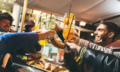 Drinking in a bar wearing masks
