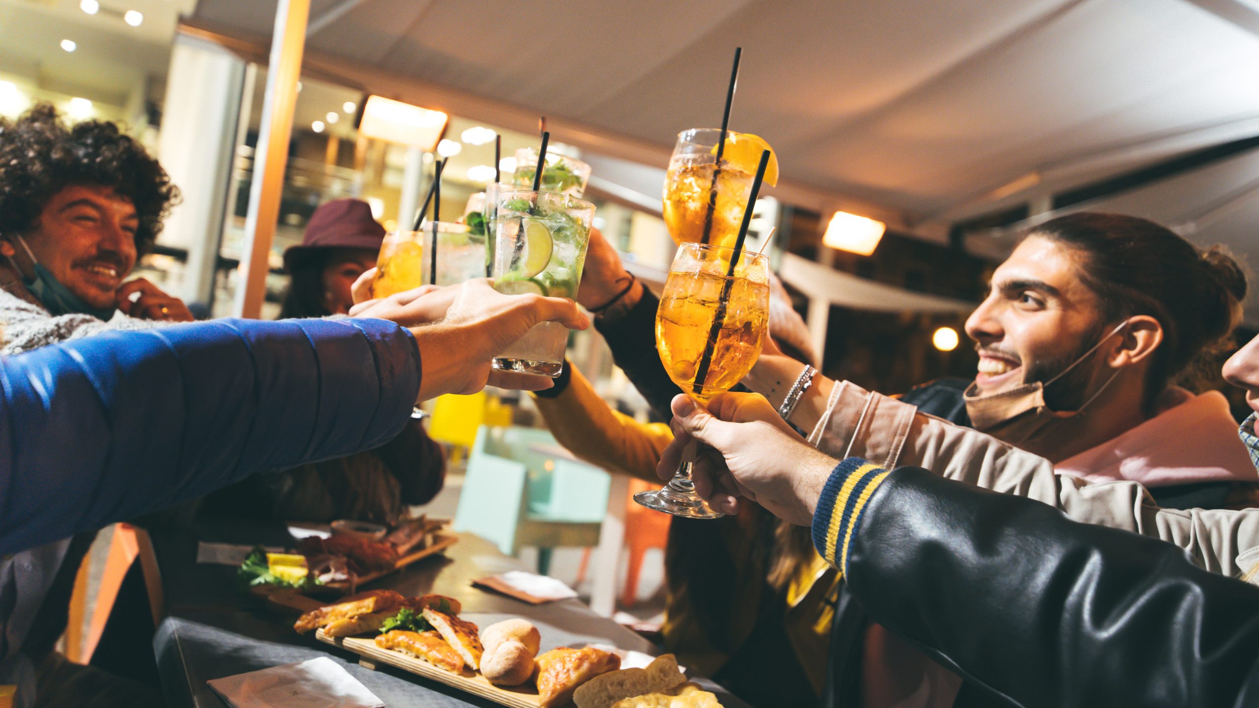 Drinking in a bar wearing masks