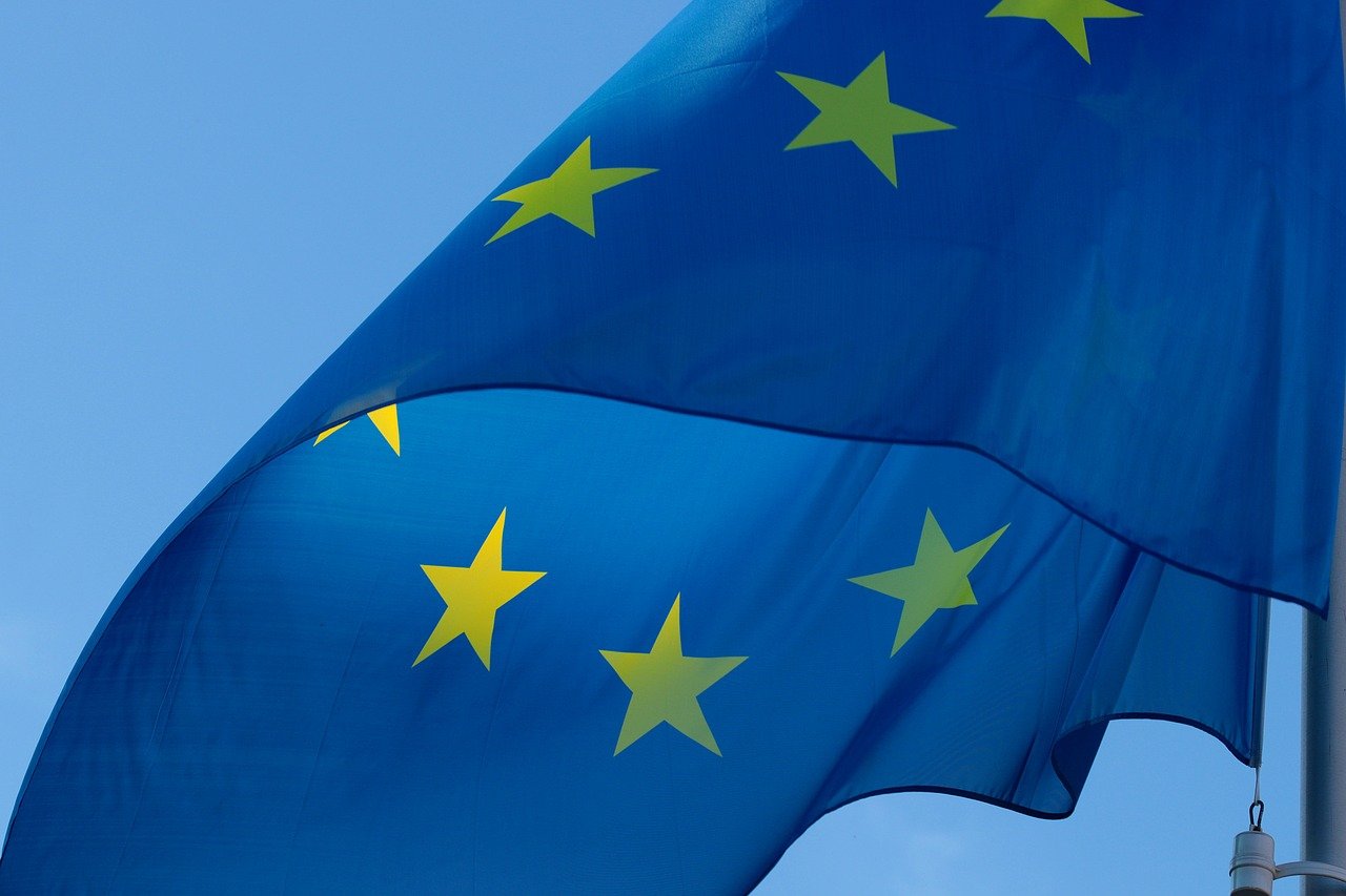 A European flag against a blue background