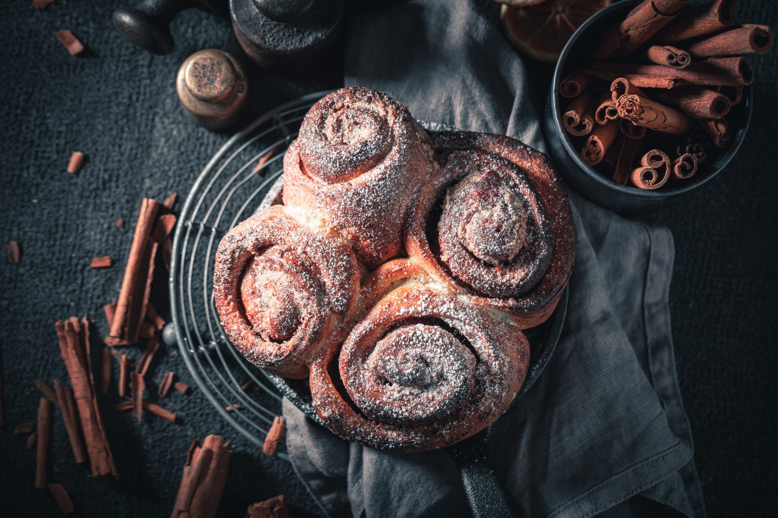 Cinnamon rolls on a plate, ready to be served.