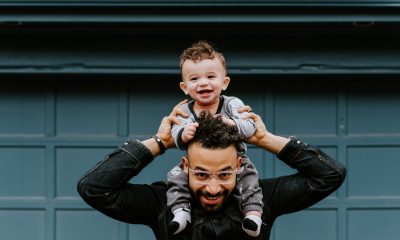 Man with child on shoulders