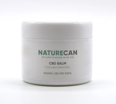 A father's day present of a white tub of CBD muscle balm with a green and Naturecan logo