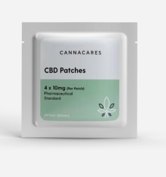 A white square patch with a green label on the inside that says CANNACARES CBD patches