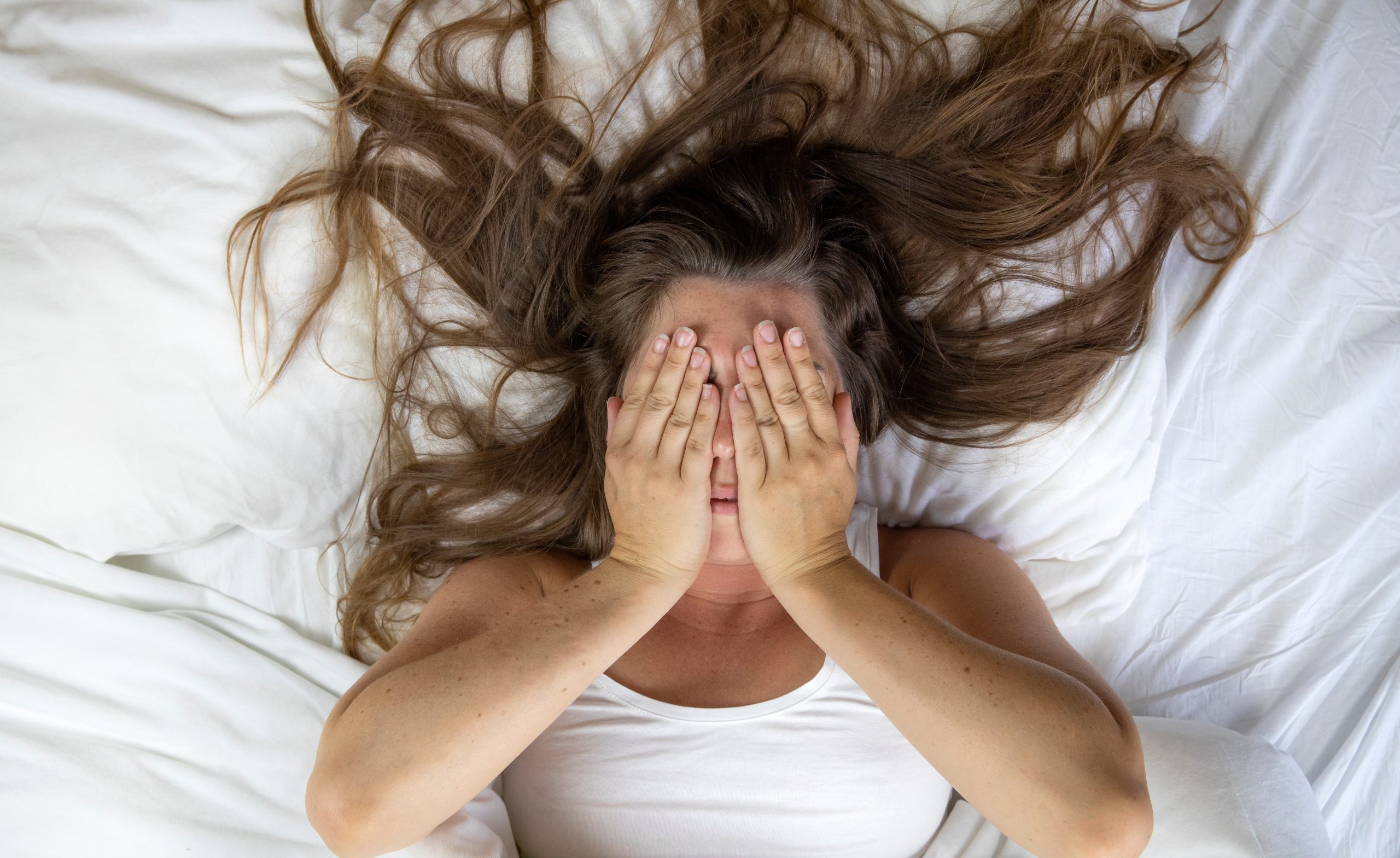 young woman getting some rest in bed.