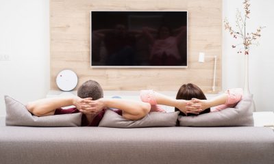 Couple watching tv docuseries "How to Change your Mind".